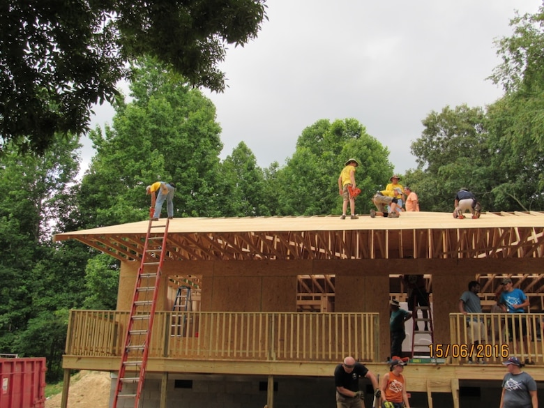 The Mountain Outreach team builds a home for a family in need.