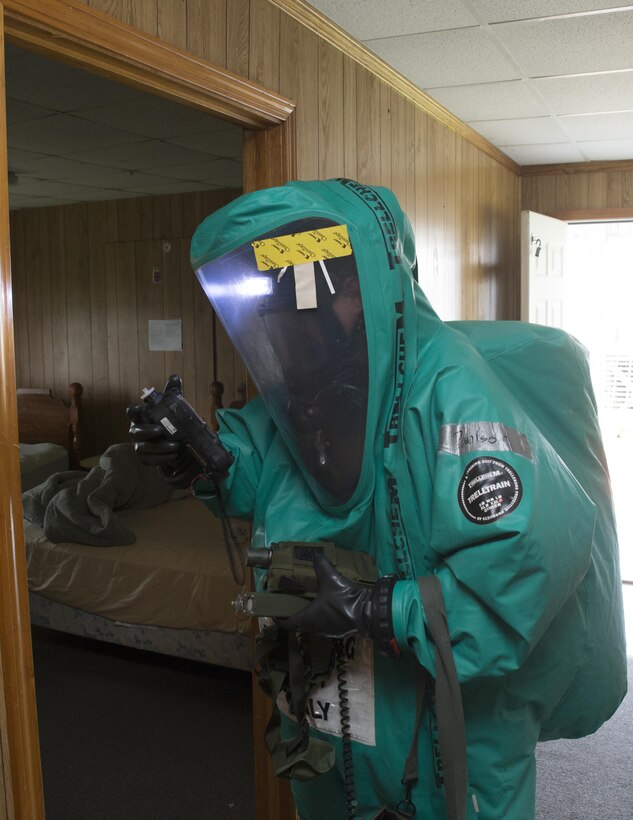Lance Cpl. Weston B. Paulson, a chemical, biological, radiological and nuclear defense specialist with CBRN Platoon, 4th Marine Logistics Group, Marine Forces Reserve, searches for the presence of hazardous materials while serving as part of a reconnaissance team during a hazardous material technician training event at Pilottown, La., July 29, 2016. During the training scenario, the Marines responded with the United States Coast Guard to a simulated chemical lab in an abandoned hotel used to produce a dangerous mustard agent. (U.S. Marine Corps photo by Sgt. Ian Leones/ Released)