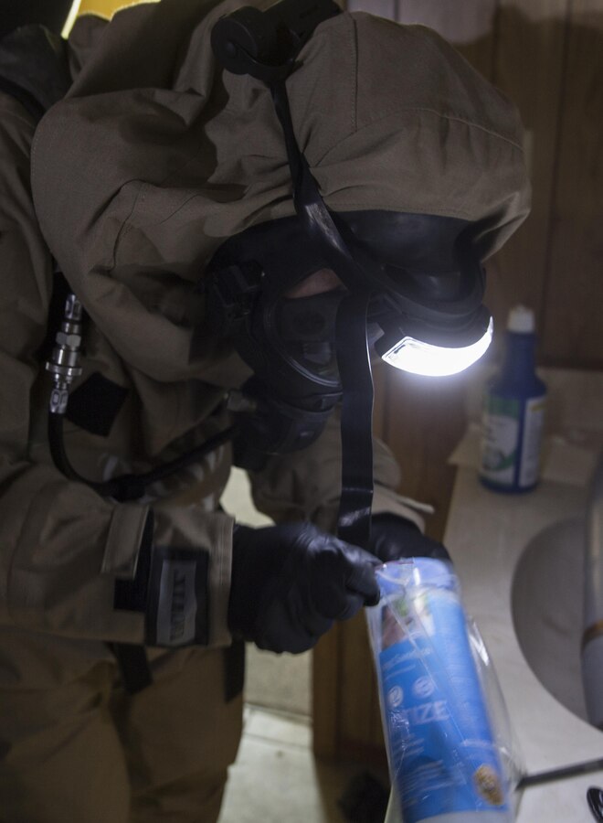 Lance Cpl. Georgiy Abgaryan, a chemical, biological, radiological and nuclear defense specialist with 2nd Battalion, 23rd Marine Regiment, 4th Marine Division, Marine Forces Reserve, places a sample into a bag at the site of a simulated chemical warfare lab in an abandoned hotel at Pilottown, La., July 29, 2016. The training event was part of a hazardous material technician training course held by MARFORRES. (U.S. Marine Corps photo by Sgt. Ian Leones/ Released)
