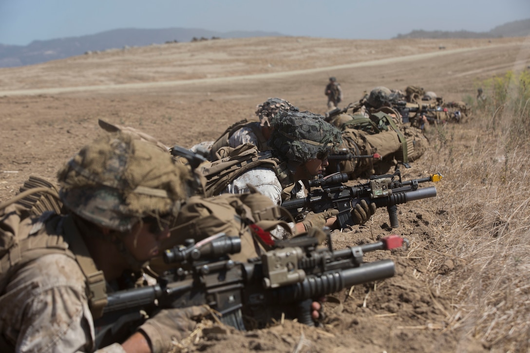Marines from 3rd Battalion, 1st Marine Regiment, 1st Marine Division provide security after being inserted into a landing zone to start their Marine Corps Readiness Evaluation at Camp Pendleton, Calif., July 28, 2016. The training allows the Marines to work through various scenarios to ensure they are ready for any situation that may arise. (U.S. Marine Corps Photo by Lance Cpl. Bradley J. Morrow)