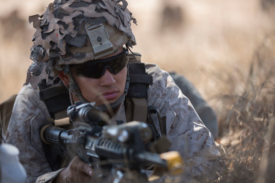 Cpl. Jalen R. Freiberg, a machine gun section leader with 3rd Battalion, 1st Marine Regiment, 1st Marine Division, provides security for Marines inserting into a drop zone during a Marine Corps Readiness Evaluation at Camp Pendleton, Calif., July 28, 2016. The training allows the Marines to work through their standard operating procedures to ensure their methods are effective in a real-life scenario. (U.S. Marine Corps Photo by Lance Cpl. Bradley J. Morrow)