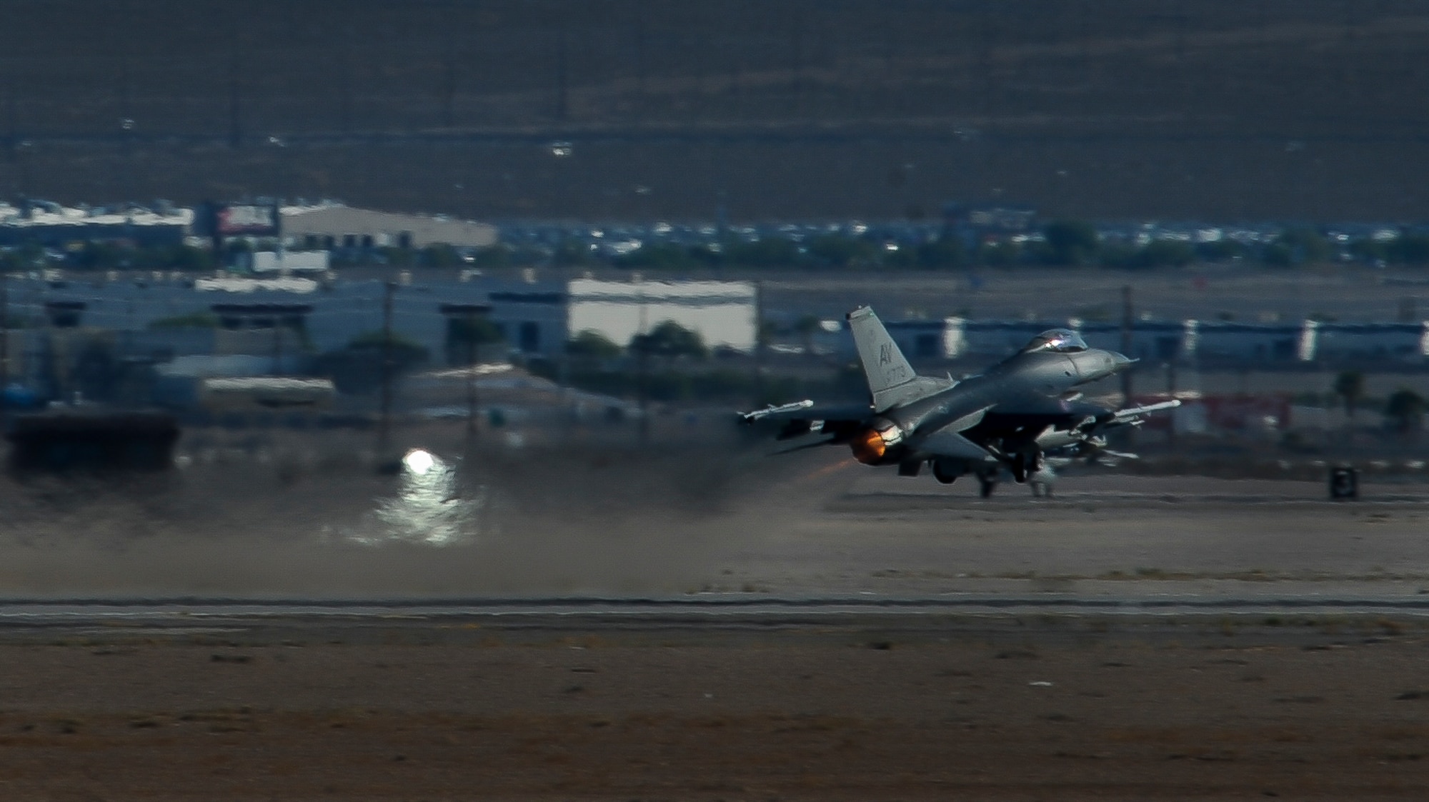 An F-16, assigned to the 555th Fighter Squadron, Aviano Air Force Base, Italy, takes off at Nellis Air Force Base, Nev., Aug. 2, 2016. Green Flag, in support of the US Army's National Training Center, provides invaluable combat training to Joint and Coalition warfighters in the art of air-land integration and the joint employment of airpower. (United States Air Force photo by Airman 1st Class Kevin Tanenbaum/Released)