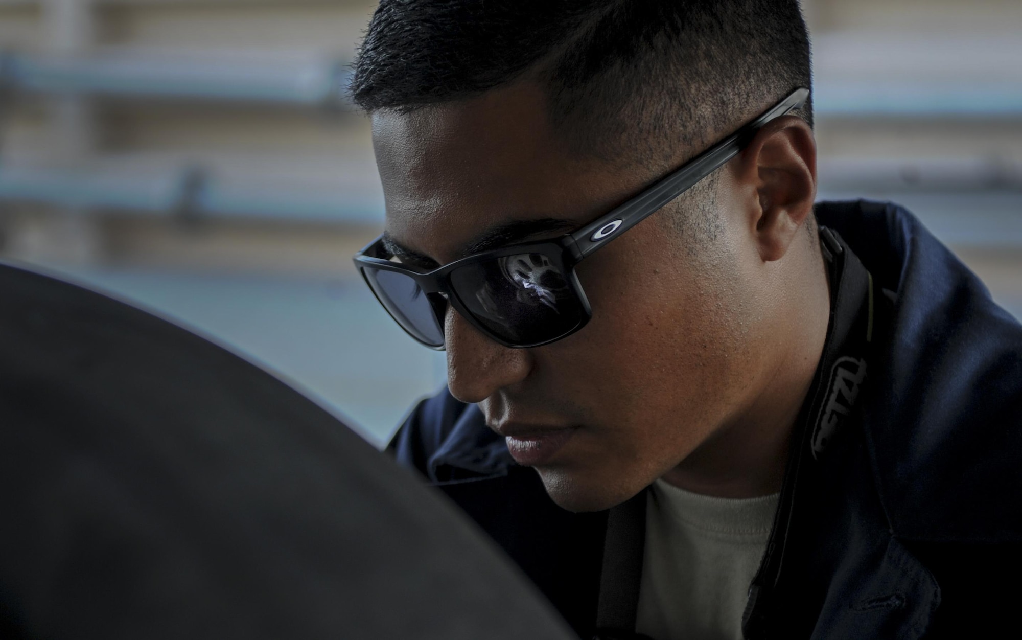 Senior Airman Manuel Jimenez, 555th Fighter Squadron Crew Chief, Aviano Air Force Base, Italy, cleans the landing gear of an F-16 Fighting Falcon before take-off at Nellis Air Force Base, Nev., August 2, 2016. The 555th is participating in a realistic air-land integration combat training exercise involving the air forces of the United States and its allies. (United States Air Force photo by Airman 1st Class Kevin Tanenbaum/Released)