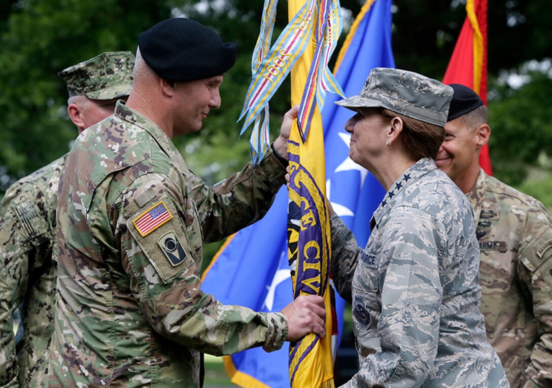 Major General Richard Gallant accepts the flag and command for Joint Task Force Civil Support from General Lori Robinson, NORAD and USNORTHCOM Commander. The change of command ceremony took place at Fort Eustis, Va., July 29, 2016.