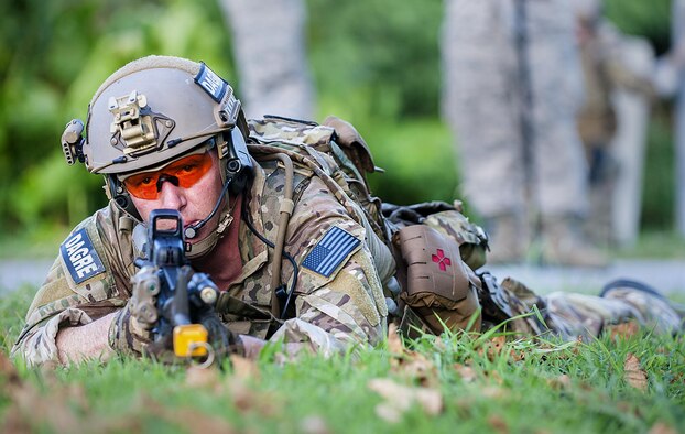 A deployed aircraft ground response element Airman with the 353rd Special Operations Support Squadron watches for any potential threats while protecting a simulated airfield during an exercise July 27, 2016, at Kadena Air Base, Japan. The DAGRE team is a special group of highly trained security forces Airmen that perform a wide range of special operations missions. (U.S. Air Force photo by Airman 1st Class Corey M. Pettis)   