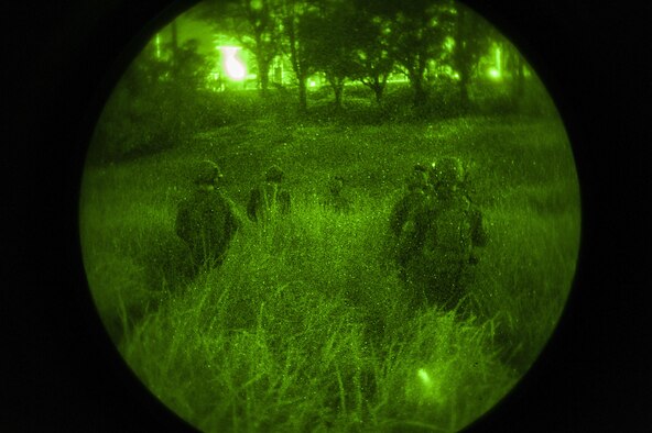 Deployed aircraft ground response element Airmen with the 353rd Special Operations Support Squadron walk through the woods to get to an objective during an exercise July 27, 2016, at Kadena Air Base, Japan. During the humanitarian aid and disaster relief exercise, the DAGRE team secured an airfield, fought off simulated enemy attackers and rescued refugees. (U.S. Air Force photo by Airman 1st Class Corey M. Pettis) 