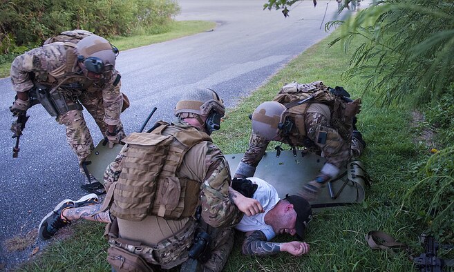 Deployed aircraft ground response element Airmen with the 353rd Special Operations Support Squadron perform simulated first aid during an exercise July 27, 2016, at Kadena Air Base, Japan. The DAGRE team participated in a humanitarian aid/disaster relief exercise. (U.S. Air Force photo by Airman 1st Class Corey M. Pettis) 