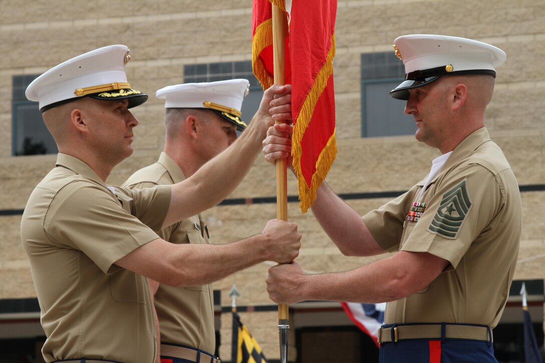 IRVINE, Calif. – Sergeant Major Jason A. Politte, Marine Corps Recruiting Station Orange County sergeant major, hands the Marine Corps colors to Maj. James P. Dollard, outgoing commanding officer, during a change of command ceremony, July 1, 2016. During his time as the station commanding officer, Dollard oversaw the recruiting process that helped create more than 3,000 Marines.(U.S. Marine Corps photo by Sgt. Vanessa Jimenez)
