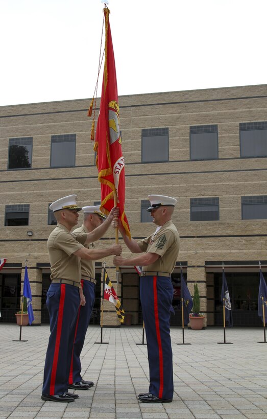 IRVINE, Calif. – Sergeant Major Jason A. Politte, Marine Corps Recruiting Station Orange County sergeant major, hands the Marine Corps colors to Maj. James P. Dollard, outgoing commanding officer, during a change of command ceremony, July 1, 2016. During his time as the station commanding officer, Dollard oversaw the recruiting process that helped create more than 3,000 Marines.(U.S. Marine Corps photo by Sgt. Vanessa Jimenez)