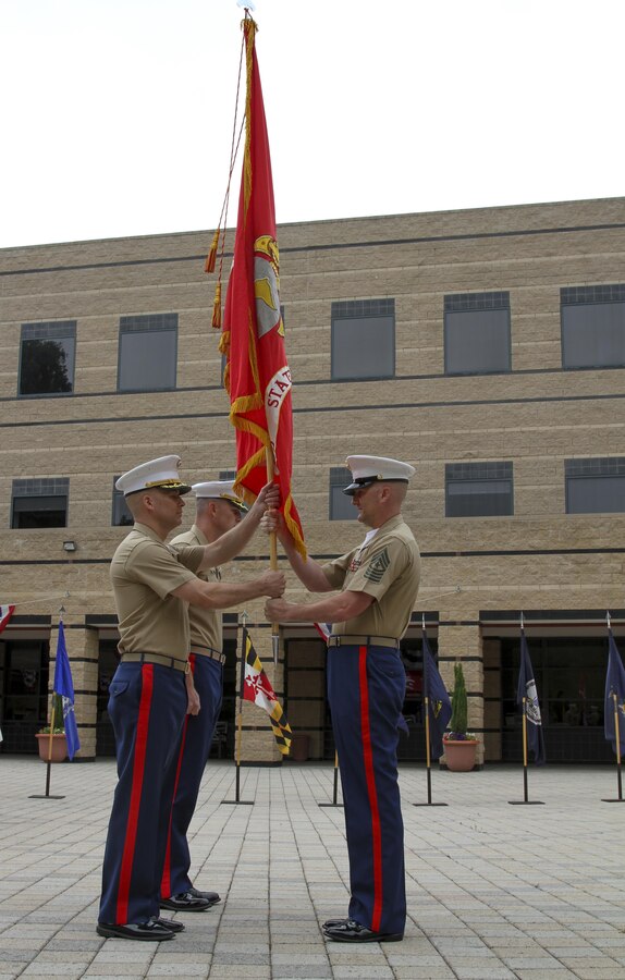 IRVINE, Calif. – Sergeant Major Jason A. Politte, Marine Corps Recruiting Station Orange County sergeant major, hands the Marine Corps colors to Maj. James P. Dollard, outgoing commanding officer, during a change of command ceremony, July 1, 2016. During his time as the station commanding officer, Dollard oversaw the recruiting process that helped create more than 3,000 Marines.(U.S. Marine Corps photo by Sgt. Vanessa Jimenez)
