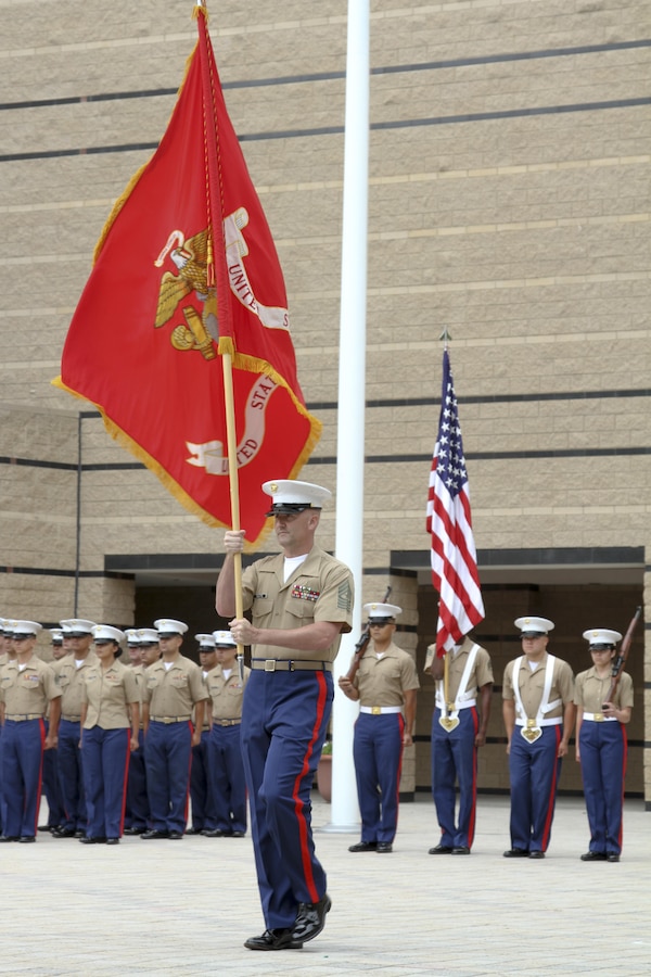 IRVINE, Calif. – Sergeant Major Jason A. Politte, Marine Corps Recruiting Station Orange County sergeant major, delivers the Marine Corps colors to Maj. James P. Dollard, outgoing commanding officer, during a change of command ceremony, July 1, 2016. During his time as the station commanding officer, Dollard oversaw the recruiting process that helped create more than 3,000 Marines. (U.S. Marine Corps photo by Sgt. Vanessa Jimenez)