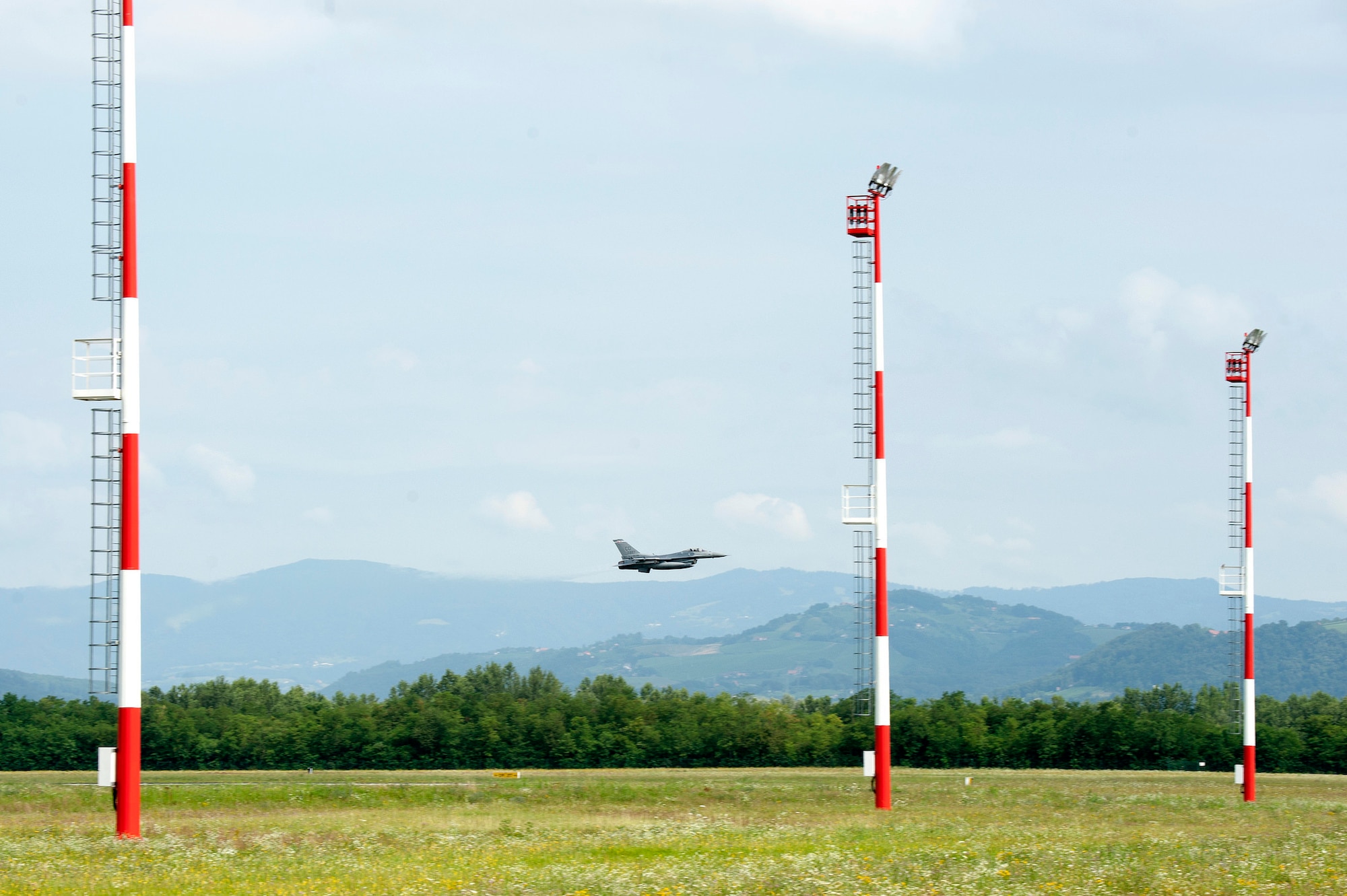 An F-16 Fighting Falcon from the 120th Fighter Squadron, 140th Wing, Colorado Air National Guard, does a low pass fly-by before landing, Cerkjle ob Krki Air Base, Slovenia, 25 July, 2016. The 140th Wing F-16 Fighting Falcons made history when they became the first F-16s to ever land at Cerkjle AB. The 140th WG is currently deployed to Hungary to train with NATO allies in Slovenia, Hungary, Slovakia and the Czech Republic in conjunction with Panther Strike 2016 and Operation Atlantic Resolve. (U.S. Air National Guard photo by Senior Master Sgt. John Rohrer)