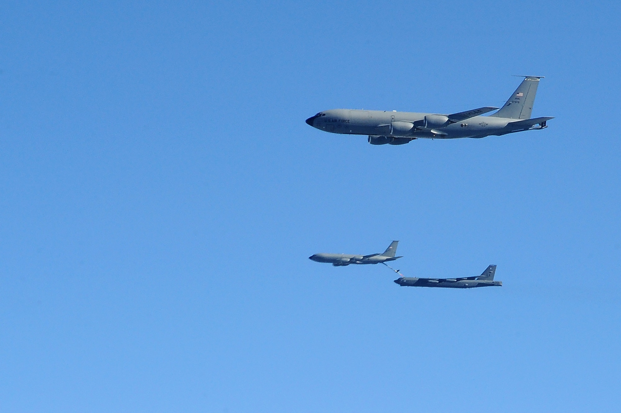 A KC-135 Stratotanker refuels a B-52 Stratofortress, above Minnesota, July 31, 2016. Four of McConnell's KC-135s provided a non-stop flight for two B-52s to participate in Polar Roar, a mission held in the Arctic Circle. Polar Roar included three non-stop, simultaneous strategic bomber routes. The B-52s and B-2 Spirits demonstrated the ability to provide a flexible and vigilant long-range global-strike capability. (U.S. Air Force photo/Airman 1st Class Christopher Thornbury)