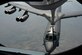 A KC-135 Stratotanker refuels a B-52 Stratofortress above Minnesota July 31, 2016. Four KC-135s from McConnell Air Force Base, Kan., assisted in refueling two B-52s to reach Polar Roar. Polar Roar is a mission in the Arctic Circle that demonstrates the ability to provide a flexible and vigilant long-range, global-strike capability. (U.S. Air Force photo/Airman 1st Class Christopher Thornbury)