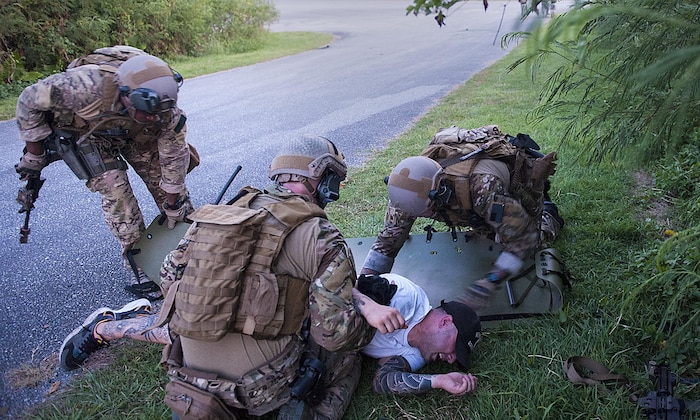 Deployed aircraft ground response element Airmen with the 353rd Special Operations Support Squadron perform simulated first aid during an exercise July 27, 2016, at Kadena Air Base, Japan. The DAGRE team participated in a humanitarian aid/disaster relief exercise. (U.S. Air Force photo by Airman 1st Class Corey M. Pettis) 