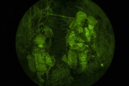 Deployed aircraft ground response element Airmen with the 353rd Special Operations Support Squadron walk through the woods to get to an objective during an exercise July 27, 2016, at Kadena Air Base, Japan. The DAGRE Airmen trekked through the woods to rescue an important person and bring them safely back to the extraction point. (U.S. Air Force photo by Airman 1st Class Corey M. Pettis)