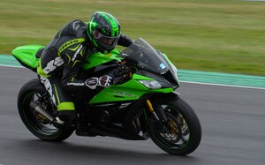 A participant in the Military Track Day rides his motorcycle July 26, 2016, at Snetterton Circuit in Norwich, England. The closed circuit enabled riders to safely navigate the track without the risk of hitting vehicles pulling out, animals running in the road or pot holes. (U.S. Air Force photo by Staff Sgt. Micaiah Anthony)