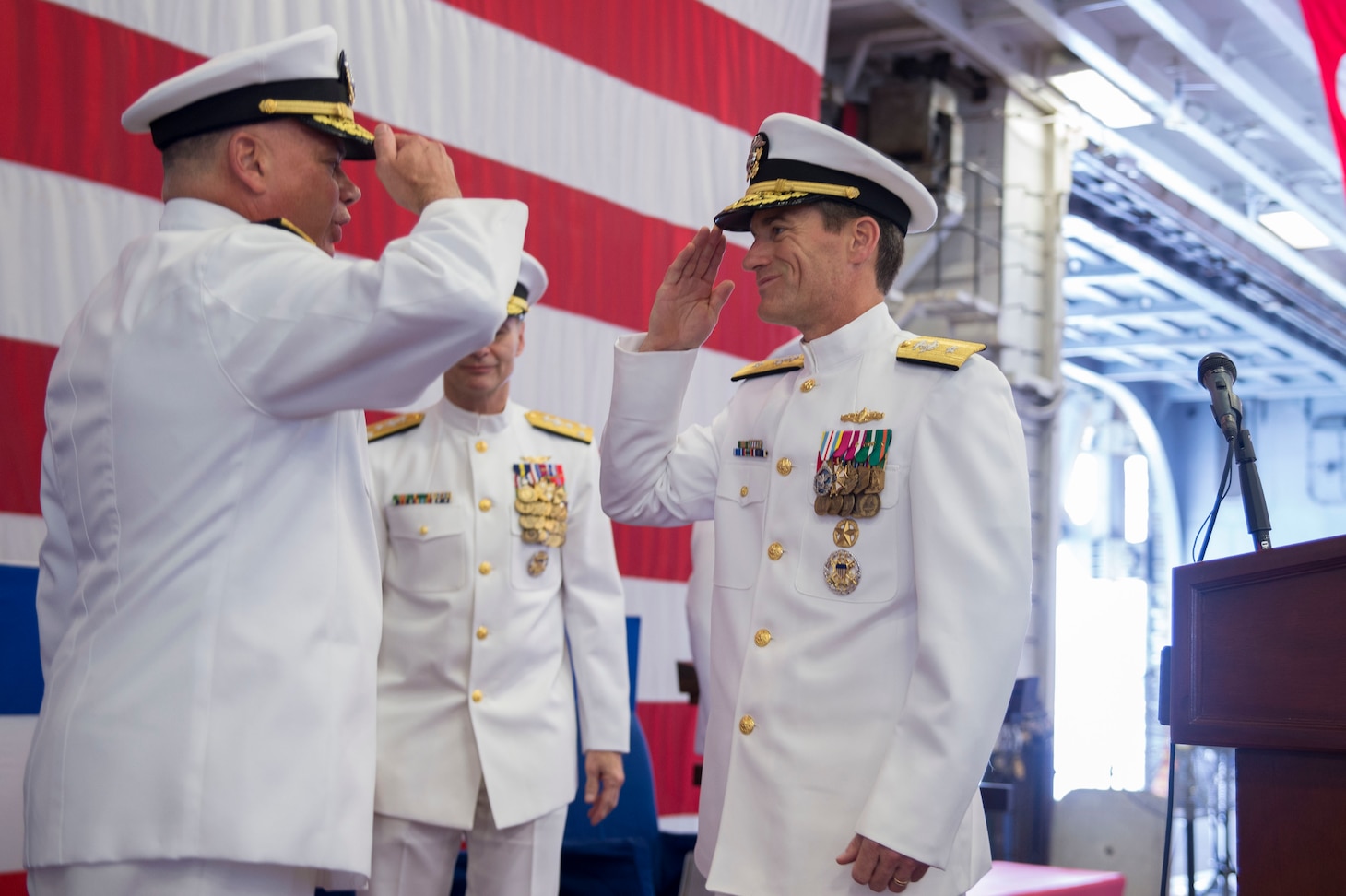 160803-N-XK809-548 SASEBO, Japan (Aug. 3, 2016) – Rear Adm. John B. Nowell, Commander, Expeditionary Strike Group (ESG) 7, turns over command to Rear Adm. Marc H. Dalton aboard amphibious assault ship USS Bonhomme Richard (LHD 6) during a change of command ceremony. (U.S. Navy Photo by Mass Communication Specialist 3rd Class William Sykes/ Released)