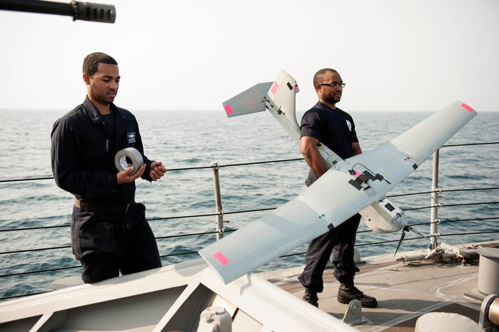 ARABIAN GULF (July 22, 2016)  - Information Systems Technician 2nd Class Jamar Webster and Electronics Technician 2nd Class Darius Jackman conduct pre-flight checks on a Puma unmanned aerial vehicle (UAV) aboard the coastal patrol ship USS Monsoon (PC 4). Monsoon is one of ten coastal patrol ships assigned to Coastal Patrol Squadron (PCRON) 1 home-ported in Manama, Bahrain in support of maritime security operations and theater security cooperation efforts in the U.S. 5th Fleet area of operation. 