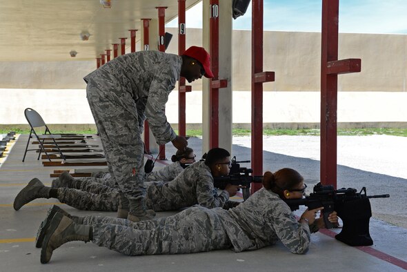 Senior Airman William Brown, 36th Security Forces Squadron combat arms instructor, gives advice to 36th SFS Airmen as they zero-in their weapons July 7, 2016, at Andersen Air Force Base, Guam. Andersen’s combat arms team trains service members and civilians from many Department of Defense organizations.  (U.S. Air Force photo by Airman 1st Class Jacob Skovo)