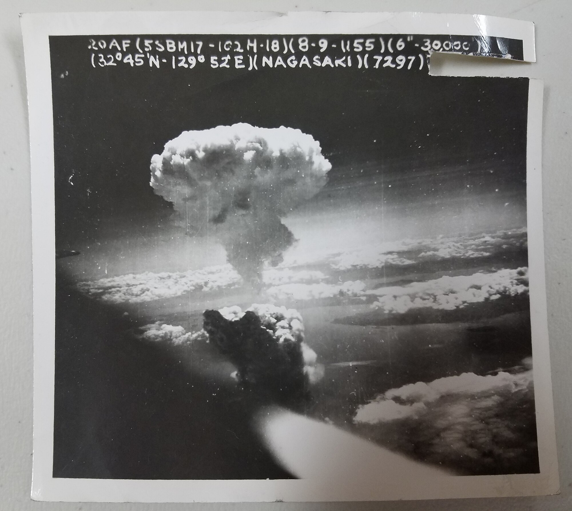WRIGHT-PATTERSON AIR FORCE BASE, Ohio –World War II veteran John Johnson, who served in the 9th Photographic Technical Squadron during the time of the atomic strikes on Hiroshima and Nagasaki, shares a historic photo of the atomic strikes during his visit with Lt. Col. Dianne Hickey, 14th Intelligence Squadron commander, June 15, 2016. Johnson was discovered after two years of historical research by the 14th IS as the unit tried to uncover its lineage. (Courtesy photo)