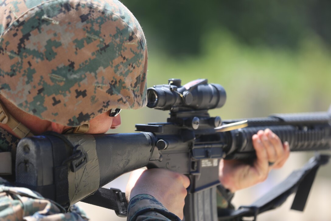 Pfc. Trent Mosher, a motor transport mechanic with 2nd Maintenance Battalion, 2nd Marine Logistics Group, engages a target as part of a live-fire exercise on Camp Lejeune, N.C., July 29, 2016. The Marines practiced shooting table three, which includes shooting drills applicable to combat situations. (U.S. Marine Corps photo by Lance Cpl. Jon Sosner)