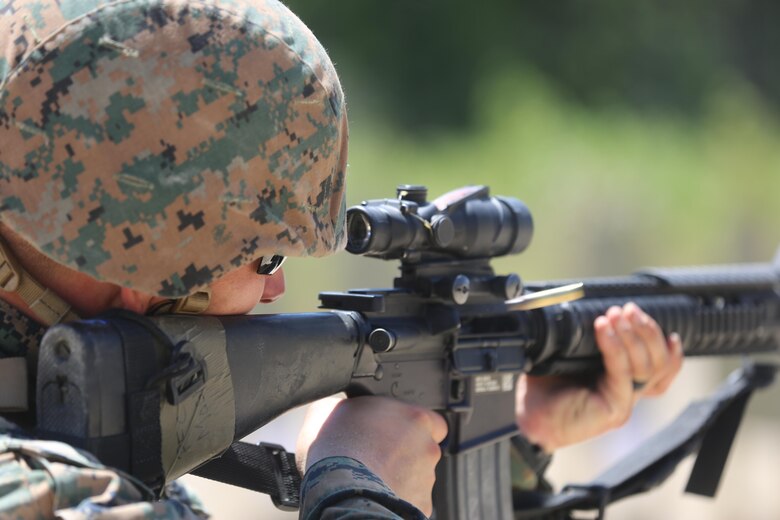 Pfc. Trent Mosher, a motor transport mechanic with 2nd Maintenance Battalion, 2nd Marine Logistics Group, engages a target as part of a live-fire exercise on Camp Lejeune, N.C., July 29, 2016. The Marines practiced shooting table three, which includes shooting drills applicable to combat situations. (U.S. Marine Corps photo by Lance Cpl. Jon Sosner)
