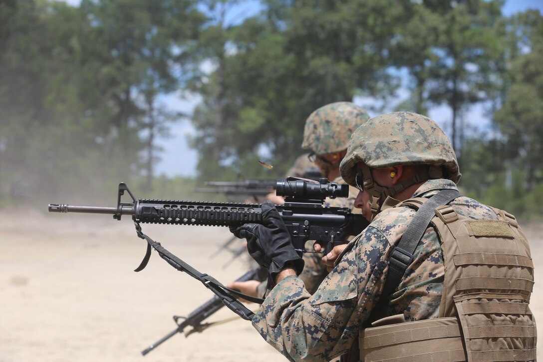 Cpl. Jacob Young, a motor transport mechanic with 2nd Maintenance Battalion, 2nd Marine Logistics Group, engages a target from the standing position during a live-fire exercise on Camp Lejeune, N.C., July 29, 2016. Over 100 Marines from the unit participated in the training to improve unit readiness. (U.S. Marine Corps photo by Lance Cpl. Jon Sosner)