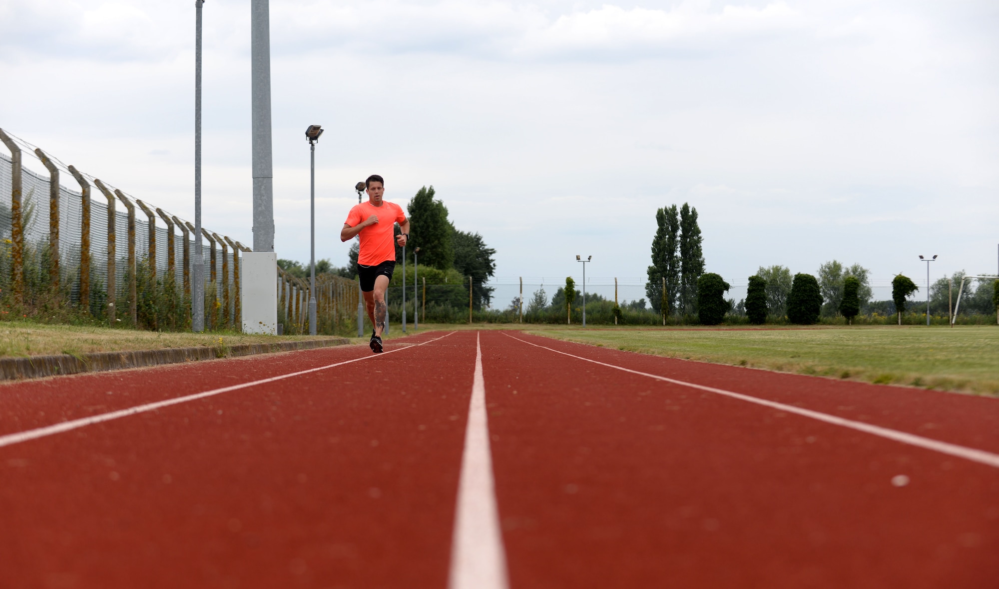 U.S. Air Force Staff Sgt. Benjamin Glenn, 352nd Special Operations Maintenance Squadron CV-22 Osprey dedicated crew chief, trains for a marathon July 28, 2016, on RAF Mildenhall, England. Glenn was chosen as one of six people to run the half marathon for Air Force Special Operations Command, in hopes of earning big points in the Major Command Challenge. (U.S. Air Force photo by Staff Sgt. Kate Thornton)