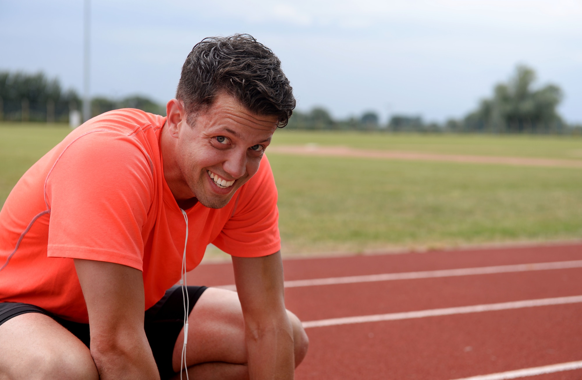 U.S. Air Force Staff Sgt. Benjamin Glenn, 352nd Special Operations Maintenance Squadron CV-22 Osprey dedicated crew chief, finishes a run July 28, 2016, on RAF Mildenhall, England. The Air Force Special Operations Command chose him to represent the command in this year’s Air Force Marathon in September. (U.S. Air Force photo by Staff Sgt. Kate Thornton)