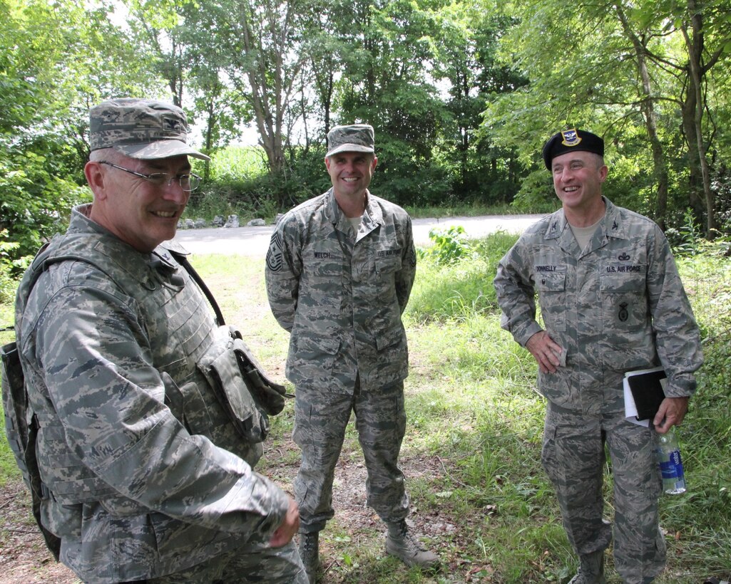 Men and women from the 932nd Airlift Wing Security Forces Squadron took time to load up vehicles, weapons, and assorted protective gear and head to the woods during a busy reserve weekend, and then went through hot weather training with hand guns and rifles. Col. Jonathan Philebaum, 932nd AW commander (left), Command Chief Master Sgt. Chad Welch (center), and Col. Timothy Donnelly, AFRC Deputy Chief of Security Forces Division, Headquarters Air Force Reserve Command (right), visited the SFS in the field on July 9, 2016, at Scott Air Force Base, Illinois. Donnelly spoke to the Airmen between training to discuss current affairs within Air Force Reserve Command Security Forces and address any concerns or questions.  (U.S. Air Force photo by Maj. Stan Paregien)