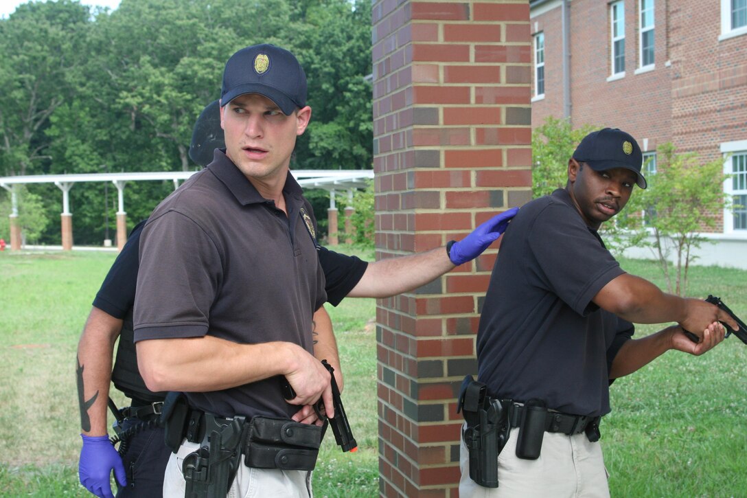 A Rescue Task Force made up of paramedics and armed law enforcement prepare to enter Crossroads Elementary School aboard Marine Corps Base Quantico to treat injured victims during an active shooter response drill July 27.