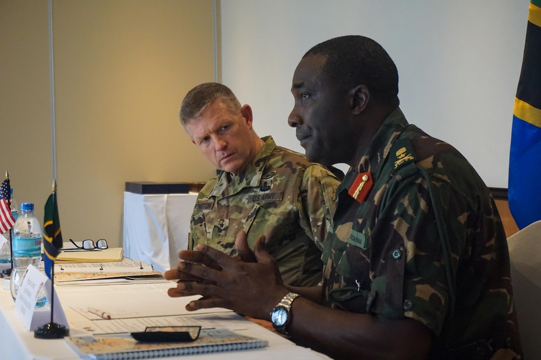 Army Maj. Gen. Joseph Harrington, U.S. Army Africa commanding general, listens to opening remarks provided by Tanzanian Brig. Gen. Jairos Mwaseba, Land Force Training Officer, during the Eastern Accord 2016 Regional Leaders Seminar held in Dar es Salaam, Tanzania, July 21, 2016. U.S. forces engage with African forces at all levels. U.S. Army photo by Capt. Jason Welch