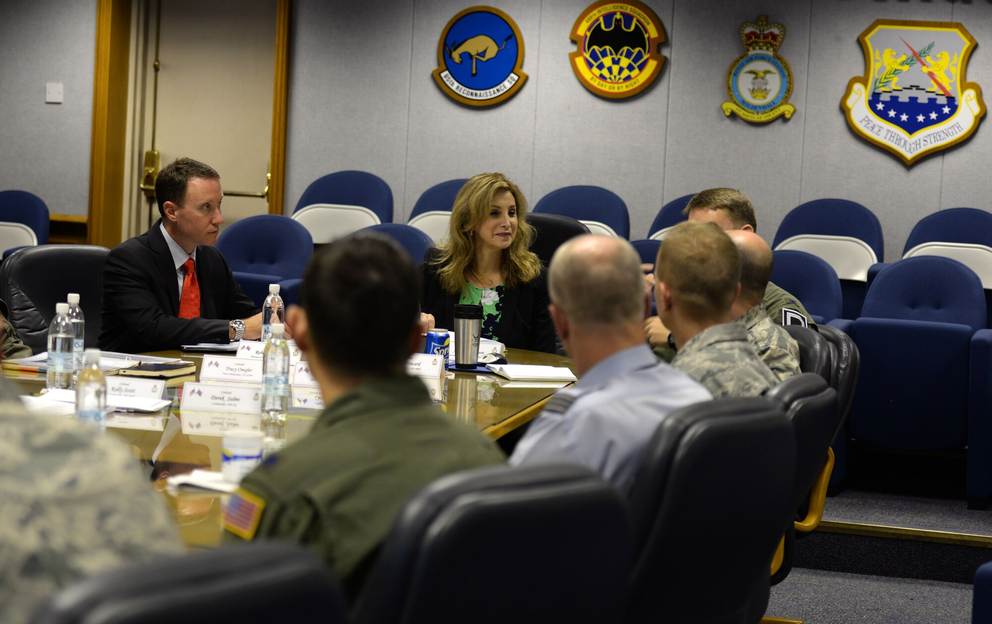 Amanda Simpson, center, Deputy Assistant Secretary of Defense for Operational Energy, discusses base units and their missions during a briefing July 29, 2016, on RAF Mildenhall, England. During the brief, Simpson learned the Team Mildenhall mission, vision and priorities from base leaders. (U.S. Air Force photo by Gina Randall)