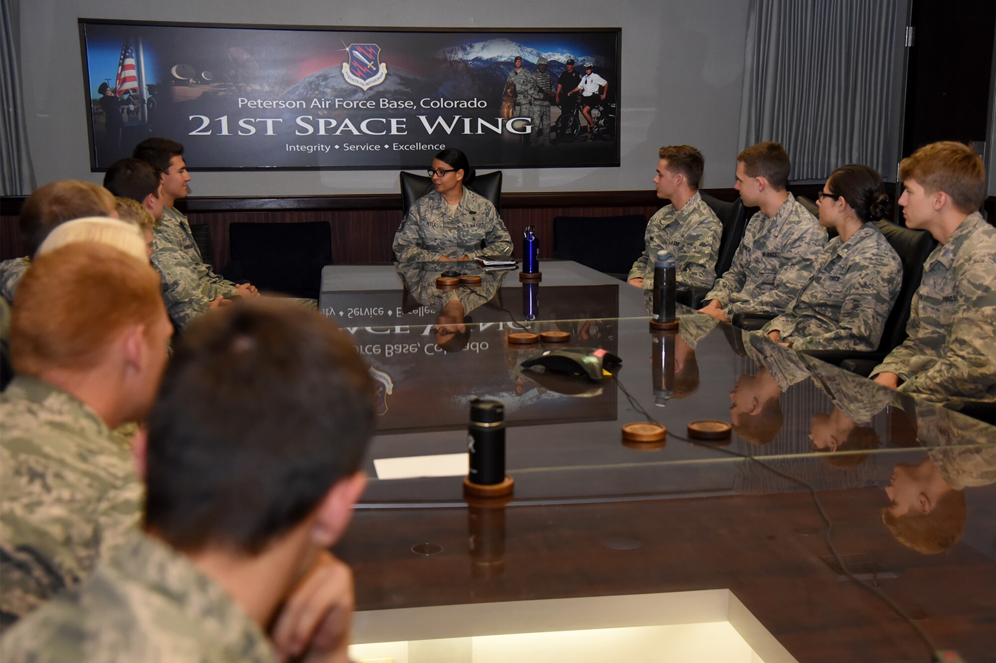 PETERSON AIR FORCE BASE, Colo. – Chief Master Sgt. Idalia Peele, 21st Space Wing command chief, chats with U.S. Air Force Academy cadets, who are entering their second-class year, as part of Operation Air Force. The program allows future leaders to spend time on active duty bases learning about mission capabilities and responsibilities in wings around the world. (U.S. Air Force photo by Airman 1st Class Dennis Hoffman)