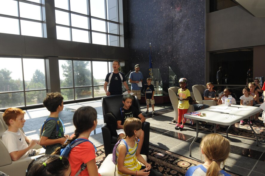 Chaplain (Capt.) Portmann Werner, 50th Space Wing, explains the rules of the race before releasing the teams for the Amazing gRace: Kids Edition at Schriever Air Force Base, Colorado, Saturday, July 30, 2016. Children, aged 7 – 18 years, competed in the event. (U.S. Air Force photo/2nd Lt. Darren Domingo)