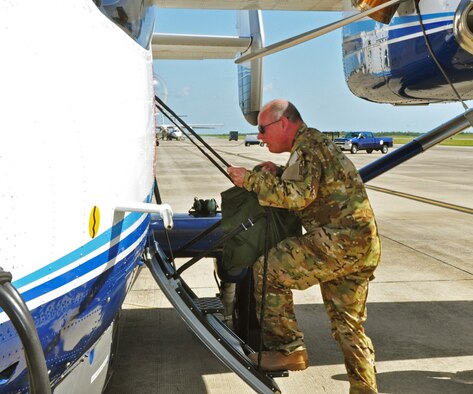 Maj. Gen. Eugene Haase, Air Force Special Operations Command vice commander, steps aboard a C-145A Skytruck on the Duke Field, Fla., flightline July 28.  In addition to piloting the aircraft on a local training mission, Haase spent the day getting a close-up look at how Duke's Reserve and active-duty Airmen work seamlessly under the Total Force Integration concept to perform their shared AFSOC mission sets. (U.S. Air Force photo/Dan Neely)