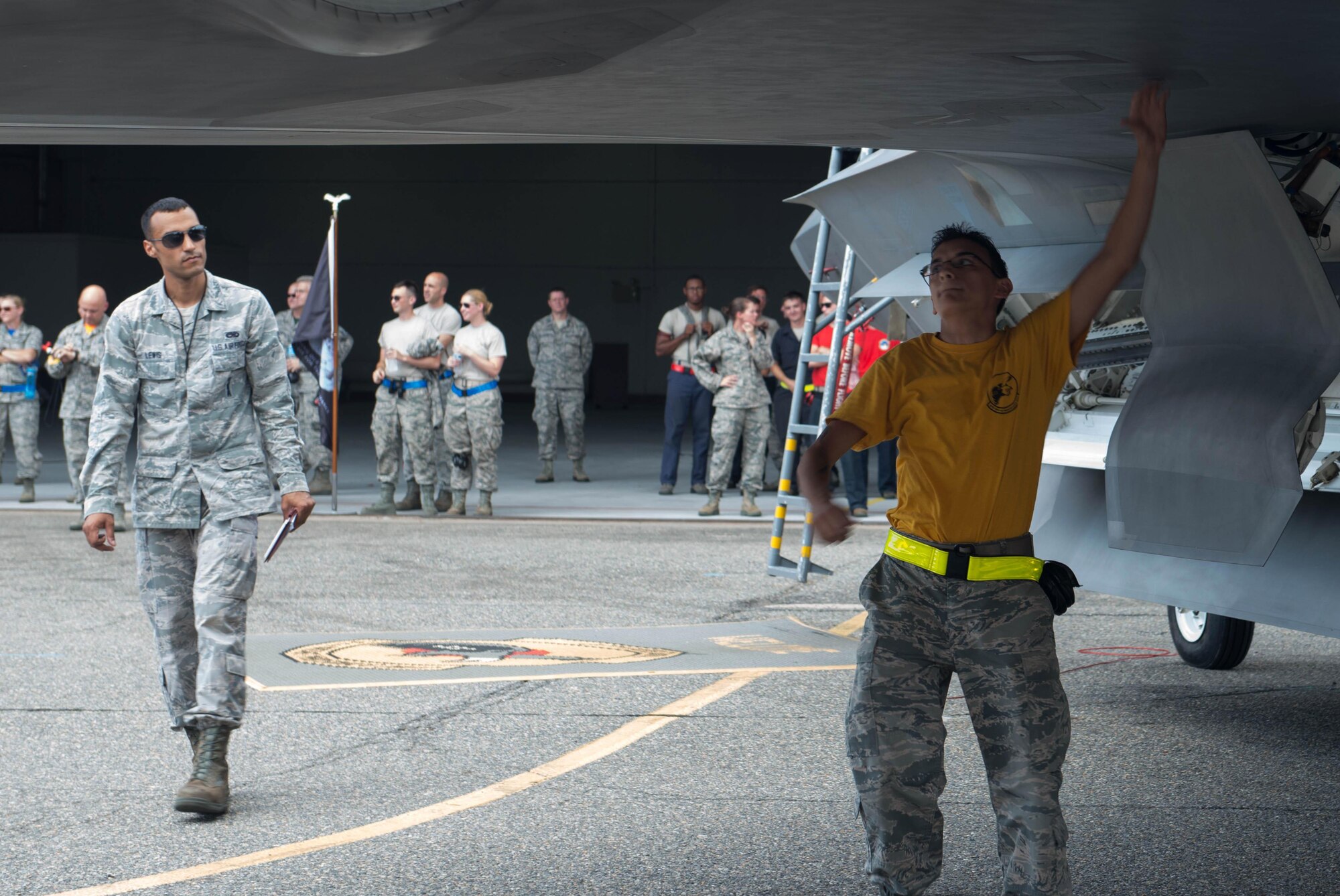 U.S. Air Force Senior Airman Isaias Florez, 27th Aircraft Maintenance Unit maintainer, inspects an F-22 Raptor during the 1st Maintenance Squadron Weapons Load Crew of the Quarter competition at Langley Air Force Base, Va., July 29, 2016. Weapons load crews worked in three-person teams to inspect and load munitions onto aircraft in a timely and accurate manner. (U.S. Air Force photo by Staff Sgt. R. Alex Durbin)