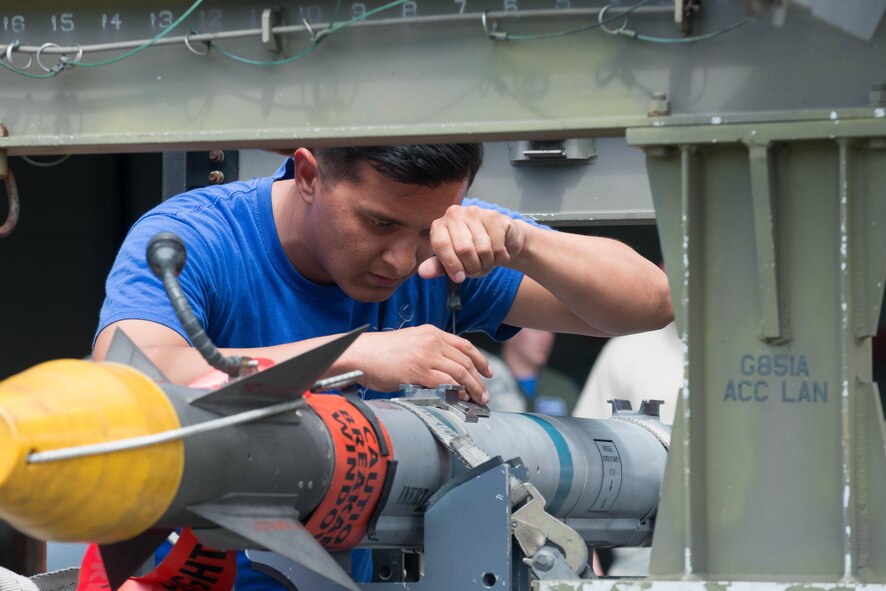 U.S. Air Force Senior Airman Komseua Phanthavong, 94th Aircraft Maintenance Unit maintainer, inspects an inert AIM-9 missile during the 1st Maintenance Squadron Weapons Load Crew of the Quarter competition at Langley Air Force Base, Va., July 29, 2016. The quarterly competition tests load crew teams’ knowledge, professionalism and ability to accurately and quickly load weapons onto an aircraft. (U.S. Air Force photo by Staff Sgt. R. Alex Durbin)