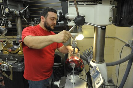 Brandon McCann, Joint Base San Antonio-Randolph Bowling Center pro shop technician, drills a bowling ball July 14 at the JBSA-Randolph bowling alley. The pro shop is certified by the International Bowling Pro Shop and Instructors Association and the United States Bowling Congress to professionally drill bowling balls and coach.  