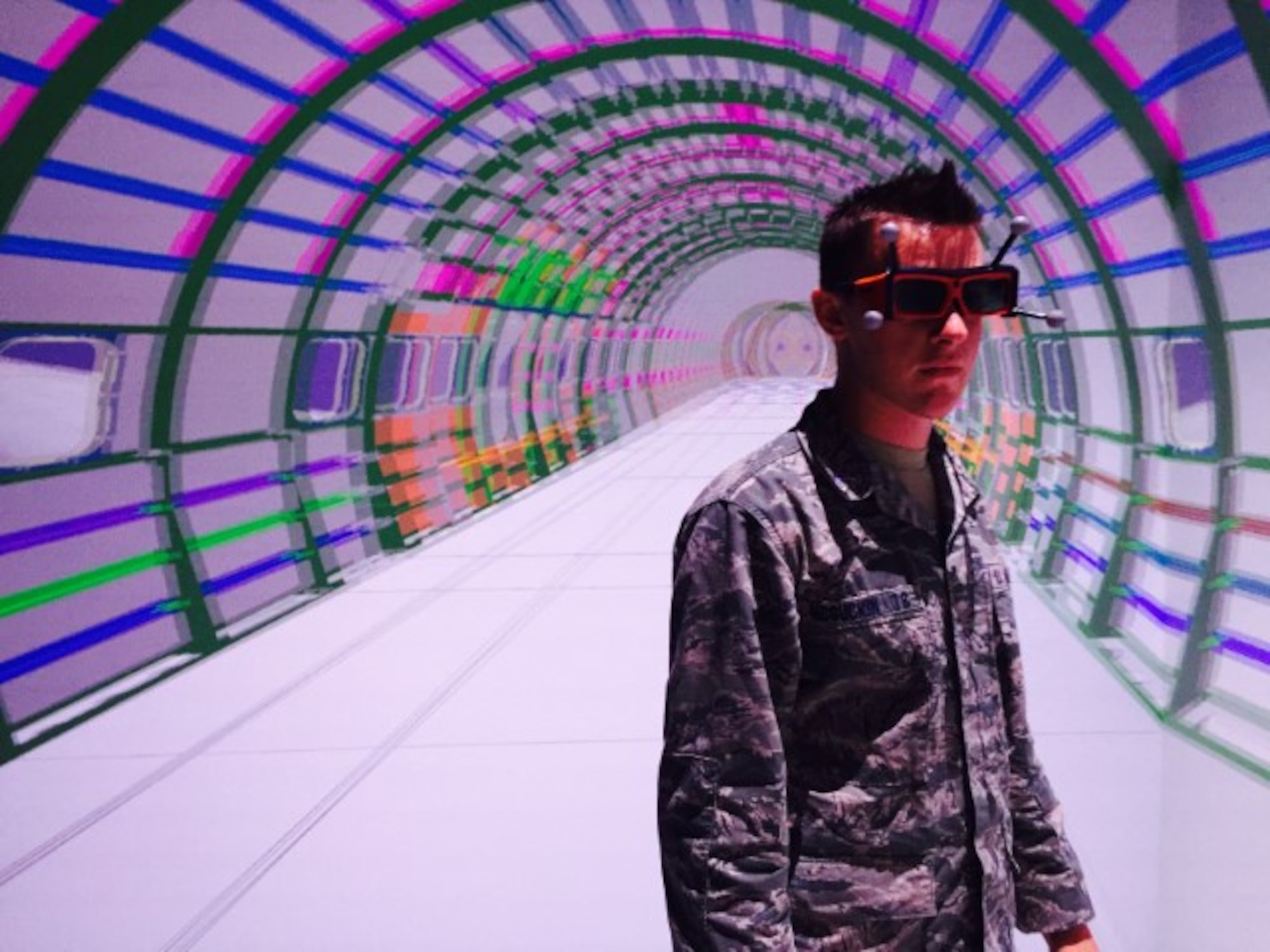 Derek McGuckin, a U.S. Air Force Academy cadet from Colorado Springs, Colo., stands inside a virtual aircraft, Aug. 1, 2016, at Wichita State University in Wichita, Kan. The cadets toured the 3-D aircraft modeling lab at the National Institute of Aviation Research to learn about aircraft safety. (Courtesy photo)