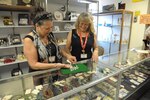 Lily Barucky (left) and Myra Phillips,volunteers, place price tags to jewely at the Randolph Thrift Shop, June 18, Joint Base San Antonio-Randolph. The Thrift Shop offers a multitude of gently used items from clothing, linens and jewelry to household wares and yard tools.  