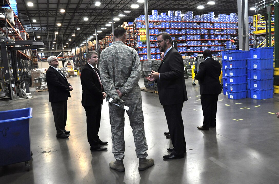 Senior employees of medical supply distributor Owens & Minor, one of DLA’s industry partners, conduct a tour of warehouse facilities for DLA Director Air Force Lt. Gen. Andy Busch during a trip to Richmond, Virginia, July 29.