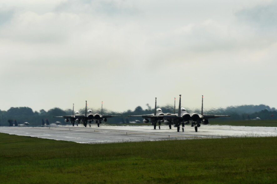 More than 15 F-15E Strike Eagle aircraft from the 336th Fighter Squadron at Seymour Johnson Air Force Base, North Carolina, prepare to depart, Aug. 2, 2016, to participate in Red Flag-Alaska 16-4 at Eielson Air Force Base, Alaska. The goal of Red Flag-Alaska is to provide each aircrew with vital mission training, to increase their chances of survival in combat environments. (U.S. Air Force photo/Airman 1st Class Ashley Williamson)