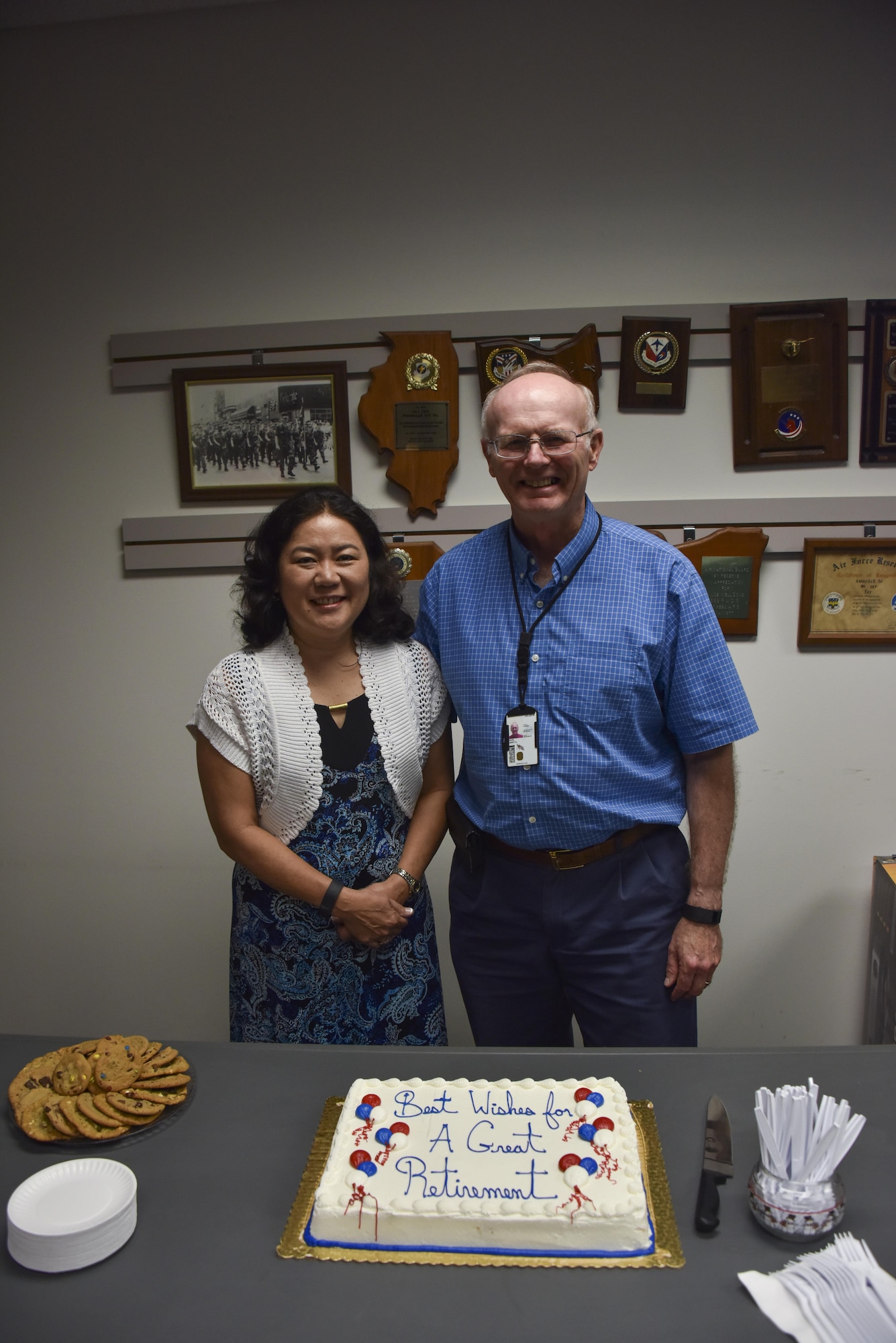 Larry Davis, general engineer for the Civil Engineering Squadron, poses for a photo with his wife, Helen, at his retirement party at the Pittsburgh International Airport Air Reserve Station July 29, 2016. Davis spent 40 years working for the Department Of Defense between his time commissioned in the Navy and as a civilian contractor for the Navy and the Air Force. (U.S. Air Force photo by Airman 1st Class Bethany Kobily)