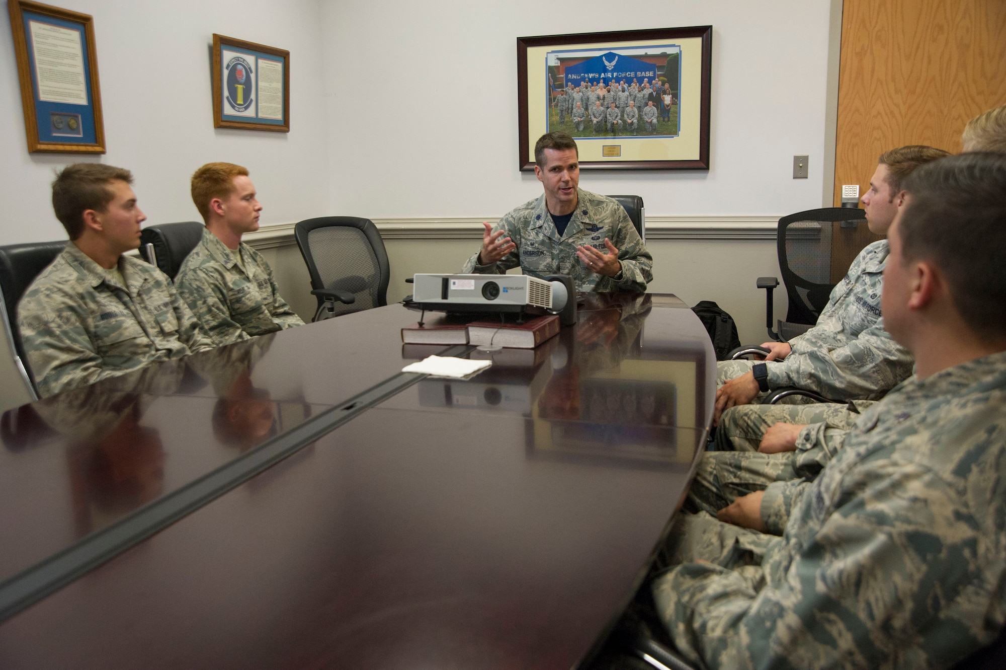 A group of U.S. Air Force Academy cadets speak with Lt. Col. Scott Anderson, Commander of the 89th Operations Support Squadron as they tour the squadron on Joint Base Andrews, Md., as part of the U.S. Air Force Academy's Operations Air Force program. (Photo by U.S. Air Force Senior Master Sgt. Adrian Cadiz)