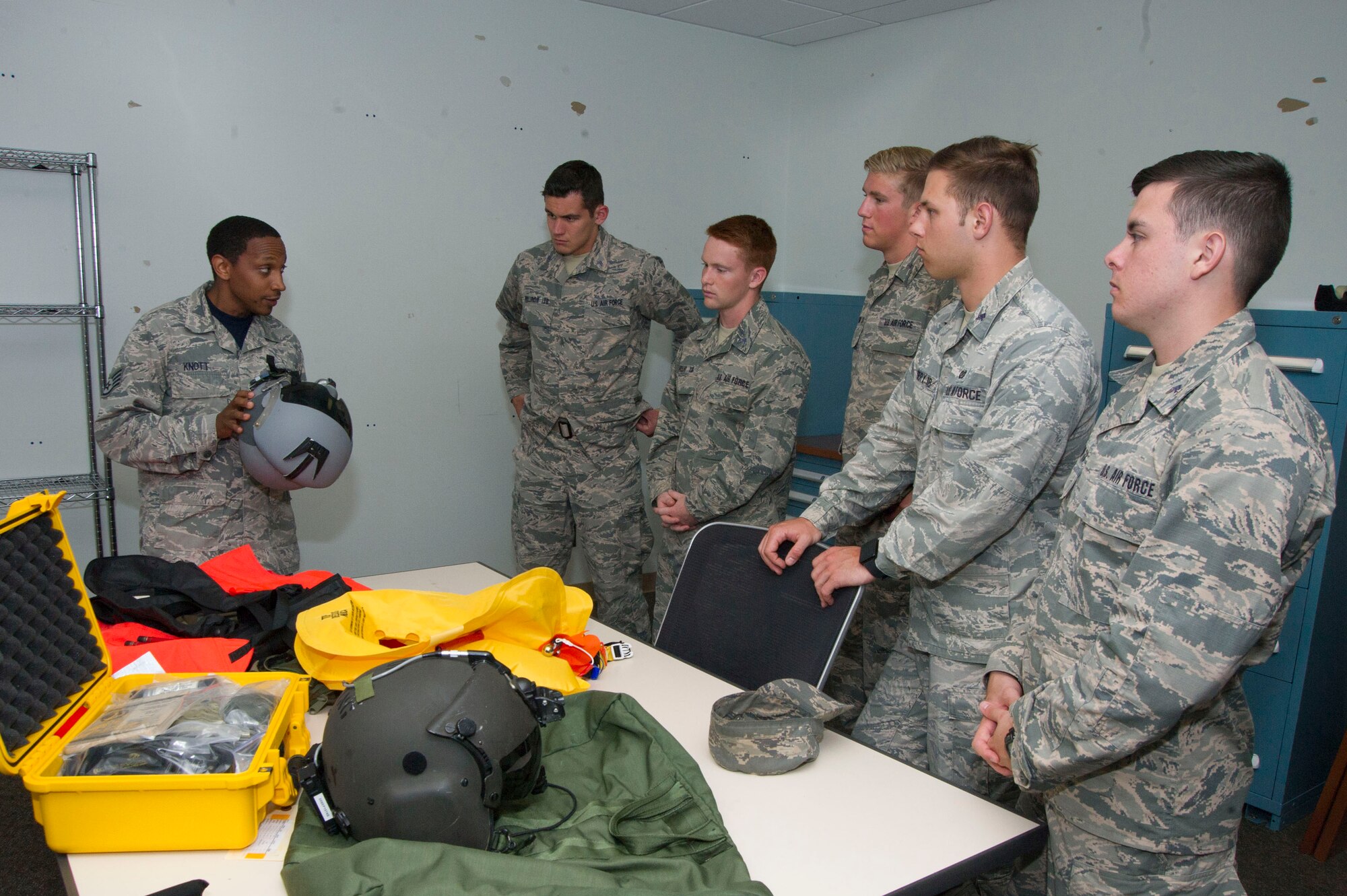 Staff Sgt. Dyral Knott  gives a group of U.S. Air Force Academy cadets a briefing and tour of the Aircrew Flight Equipment section during a tour of the 89th Operations Support Squadron at Joint Base Andrews, Md. The cadets visited the base as part of the U.S. Air Force Academy's Operations Air Force program. (Photo by U.S. Air Force Senior Master Sgt. Adrian Cadiz)
	
