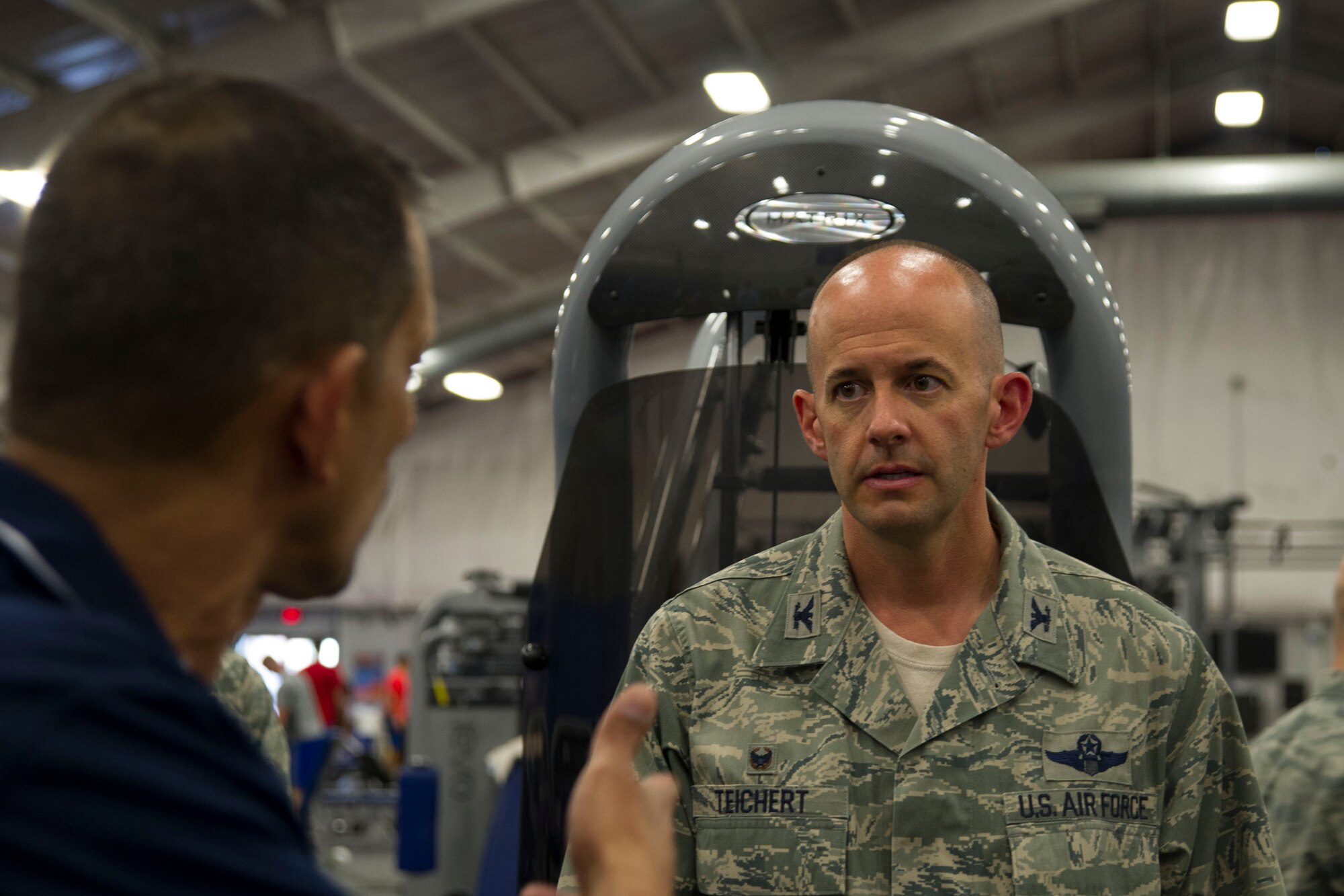 Col. John Teichert, 11th Wing and Joint Base Andrews commander, discusses potential gym improvements with Isaac Melendez, 11th Force Support Squadron fitness director, at the West Fitness Center on JBA, Md., Aug. 1, 2016. Teichert visited several of the 11th Mission Support Group squadrons with Chief Master Sgt. Beth Topa, 11th WG command chief master sergeant, to become more familiar with the squadrons’ missions and meet with “America’s Airmen." (U.S. Air Force photo by Airman 1st Class Rustie Kramer)