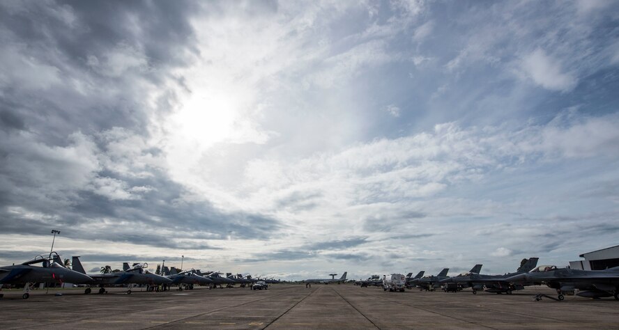U.S. Air Force F-16 Fighting Falcons from the 13th Fighter Squadron, taxi during exercise Cope Taufan 2016, at Pangkalan Udara Butterworth Air Base, Malaysia, July 28, 2016. The F-16s are from Misawa Air Base, Japan, and F/A -18s are from Butterworth Air Base are participating in CT 16. CT 16 is a PACAF-led exercise that reinforces U.S. Pacific Command Theater Security Cooperation goals for the Southeast Asia region and demonstrates U.S. capability to project forces strategically in a combined, joint environment.  More than 450 Airmen are participating, as well as four U.S. Air Force airframes.  (U.S. Air Force photo by Tech. Sgt. Araceli Alarcon)
