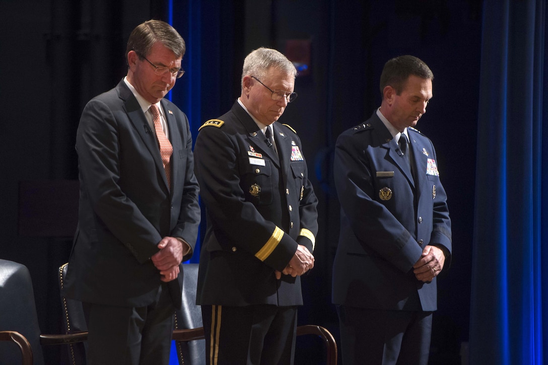 From left, Defense Secretary Ash Carter, Army Gen. Frank Grass and Air Force Gen. Joseph L. Lengyel observe the invocation during a National Guard Bureau change-of-responsibility ceremony at the Pentagon, Aug. 3, 2016. Lengyel took over as chief of the bureau during the ceremony, succeeding Grass. DoD photo by Navy Petty Officer 1st Class Tim D. Godbee